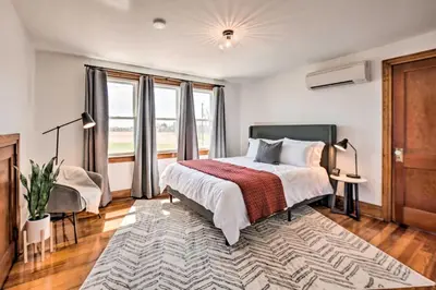 a bedroom with a bed and a large window at Home 2 Mi to Hersheypark Work and Play! in Hershey