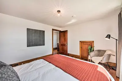 a bedroom with a bed and a chair at Home 2 Mi to Hersheypark Work and Play! in Hershey