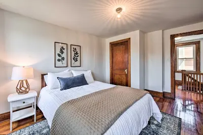 a bedroom with a bed with a blue pillow on it at Home 2 Mi to Hersheypark Work and Play! in Hershey