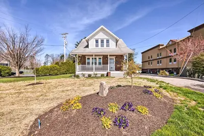 a house with a flower bed in the yard at Home 2 Mi to Hersheypark Work and Play! in Hershey