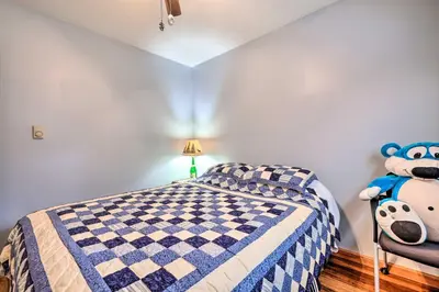 a bedroom with a bed and a teddy bear at Walk to Beach Lakefront Pocono Escape with Fire Pit in Pocono Lake