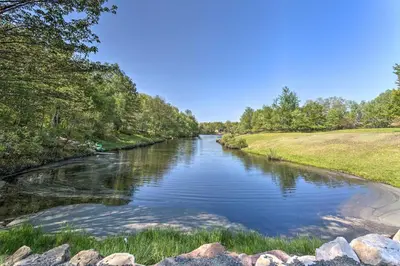 a river with rocks and trees on the side at 6 Mi to Camelback Slopes! Home with Game Room in Long Pond