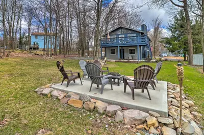 a group of chairs sitting around a table in a yard at 6 Mi to Camelback Slopes! Home with Game Room in Long Pond