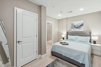 a bedroom with a bed and a white door at Stay at Luna on Callowhill in Philadelphia