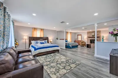 a bedroom with a bed and a couch in a room at 1 Mi to Hersheypark Family Home with Game Room! in Hershey