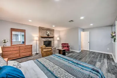 a bedroom with a bed and a fireplace at 1 Mi to Hersheypark Family Home with Game Room! in Hershey