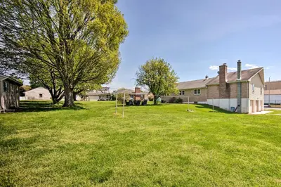 a yard with a tree and a house at 1 Mi to Hersheypark Family Home with Game Room! in Hershey