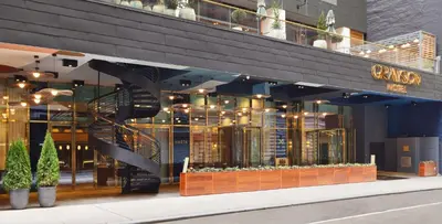 a store front of a building with a staircase at Grayson Hotel in New York