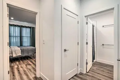 a hallway with two doors leading to a bedroom at Trendy Apt with Laundry Machines Less Than 3 Mi to Dtwn in Philadelphia