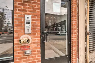 a door to a building with a sign on it at Trendy Apt with Laundry Machines Less Than 3 Mi to Dtwn in Philadelphia