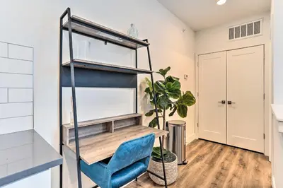 a room with a desk and a blue chair at Central Pet-Friendly Apt - Minutes to Dtwn! in Philadelphia