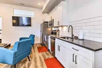 a kitchen with two blue chairs and a sink at Central Pet-Friendly Apt - Minutes to Dtwn! in Philadelphia