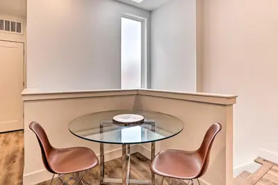a glass table and two chairs in a room at Central Pet-Friendly Apt - Minutes to Dtwn! in Philadelphia