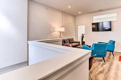 a living room with a couch and chairs and a tv at Central Pet-Friendly Apt - Minutes to Dtwn! in Philadelphia
