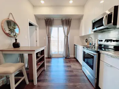 a kitchen with a table and a counter top at Stay at Luna on Ridge Ave in Philadelphia