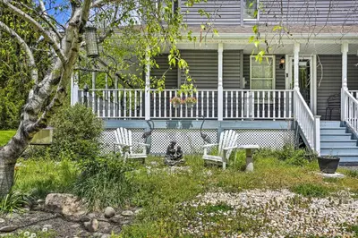 a house with a porch with two white benches at Pet-Friendly Pond View Loft with Private Pool! in Walden