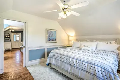 a bedroom with a bed and a ceiling fan at Pet-Friendly Pond View Loft with Private Pool! in Walden