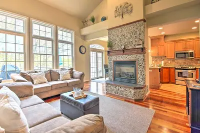 a living room with couches and a fireplace at Community Perks and Deck Lake Harmony Townhome! in Lake Harmony