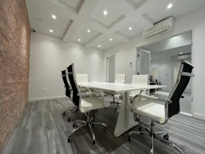 a conference room with a white table and chairs at Hotel and the City, Rooftop City View in New York