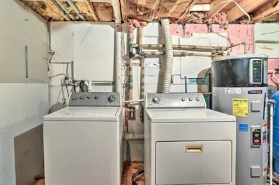 two washing machines are sitting in a room at Walk to Lake and Beach Pocono Cabin with Fire Pit in Pocono Lake