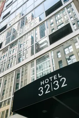 a hotel sign in front of a building at Hotel 32 32 in New York