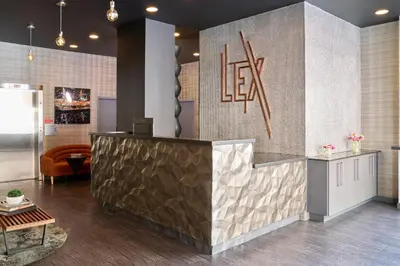 a lobby with a reception desk and a sign at Lex Hotel NYC in New York