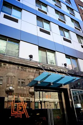 a building with a blue umbrella in front of it at Lex Hotel NYC in New York