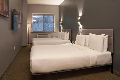 a hotel room with two beds and a window at Lex Hotel NYC in New York