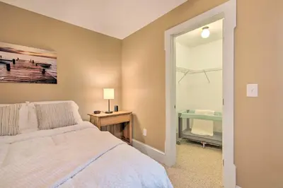 a bedroom with a bed and a table with a lamp at Large Yard and Games Edgewater Escape in Paupack! in Paupack