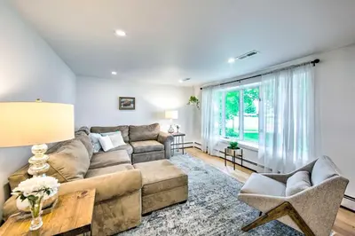 a living room with a couch and a table at 3 Mi to Dutch Wonderland Serene Home with Deck in Lancaster