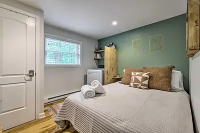 a bedroom with a bed with towels on it at Near Lakes and Resorts Pet-Friendly Long Pond Abode in Long Pond