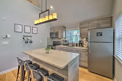 a kitchen with a refrigerator and a table and chairs at Near Lakes and Resorts Pet-Friendly Long Pond Abode in Long Pond