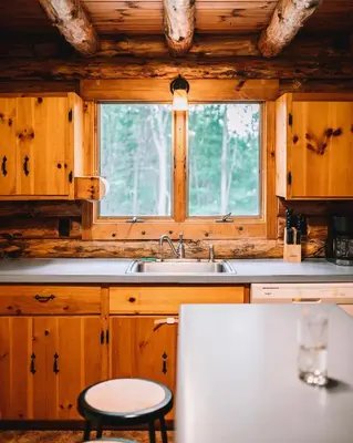 a kitchen with a sink and a window at Afton Cabin in Afton