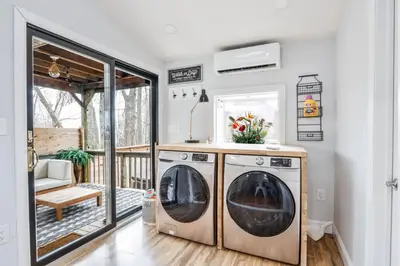 a laundry room with a washer and dryer at Beautiful Mount Pocono Chalet with Hot Tub!! in Tobyhanna