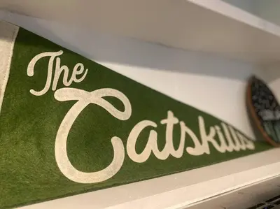 a sign that says the cantina on a shelf at The Cabin @ Benton Hollow in Livingston Manor