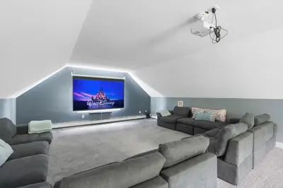 a living room with a couch and a flat screen tv at Malkita Aria Mountainview Retreat in Woodbury