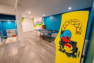 a room with a skateboard in a room with a table at Malkita Aria Mountainview Retreat in Woodbury