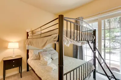 a bedroom with a bunk bed and a staircase at Half-Mi to Big Boulder Lake Townhome with Deck! in Lake Harmony