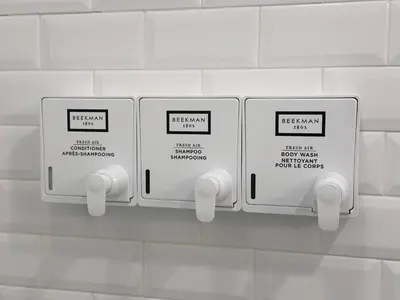 two electrical outlets on a white tiled wall at Sosuite at French Quarters - Rittenhouse Square in Philadelphia