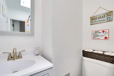 a bathroom with a sink and a mirror at about 4 Mi to Downtown Philadelphia Cozy Retreat in Philadelphia
