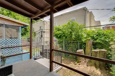 a balcony with a fence and a building at about 4 Mi to Downtown Philadelphia Cozy Retreat in Philadelphia