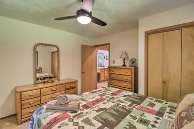 a bedroom with a bed and a ceiling fan at Deck and Resort Amenities Pocono Lake Home in Pocono Lake