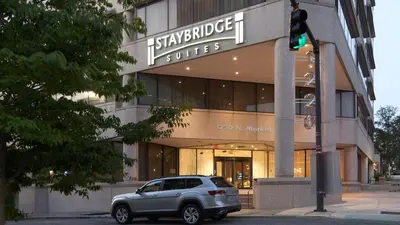 a car parked in front of a building at Staybridge Suites Wilmington Downtown by IHG in Wilmington