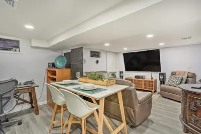 a living room with a table and a couch at Saddle Brook Studio with Patio - Near NYC! in Saddle Brook