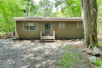 a small green house with a tree in front of it at Near Skiing and Hiking Gouldsboro Home with Hot Tub in Gouldsboro