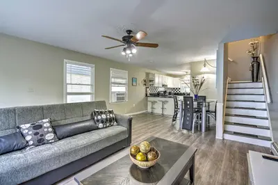 a living room with a couch and a table at Family-Friendly Keansburg Home Walk to Beach! in Keansburg