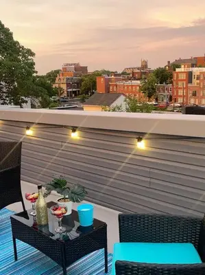 a balcony with a table with drinks on it at THE ROOFTOP OASIS in Philadelphia