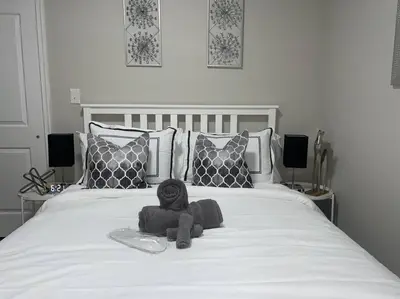a stuffed animal sitting on top of a bed at THE ROOFTOP OASIS in Philadelphia
