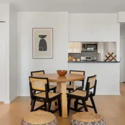 a dining room with a wooden table and chairs at Family Apartment in Excellent Sector of New York in New York