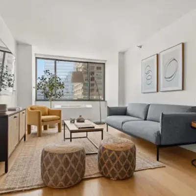 a living room with a couch and a table at Family Apartment in Excellent Sector of New York in New York